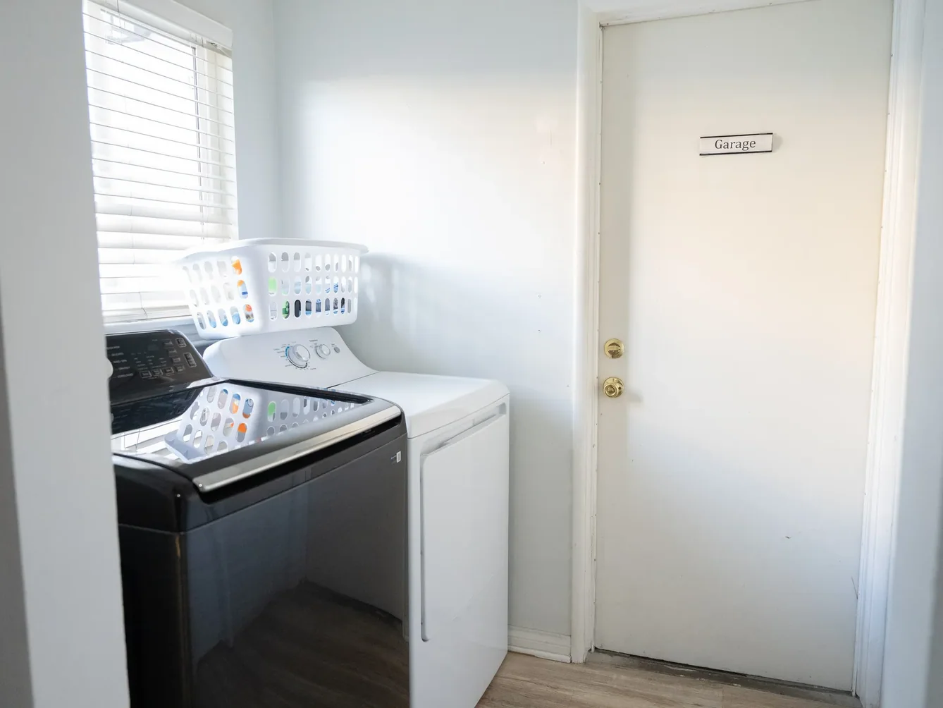 Bright laundry room with modern washer and dryer